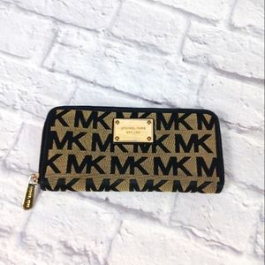 Michael Kors black and tan signature canvas and leather zip wallet